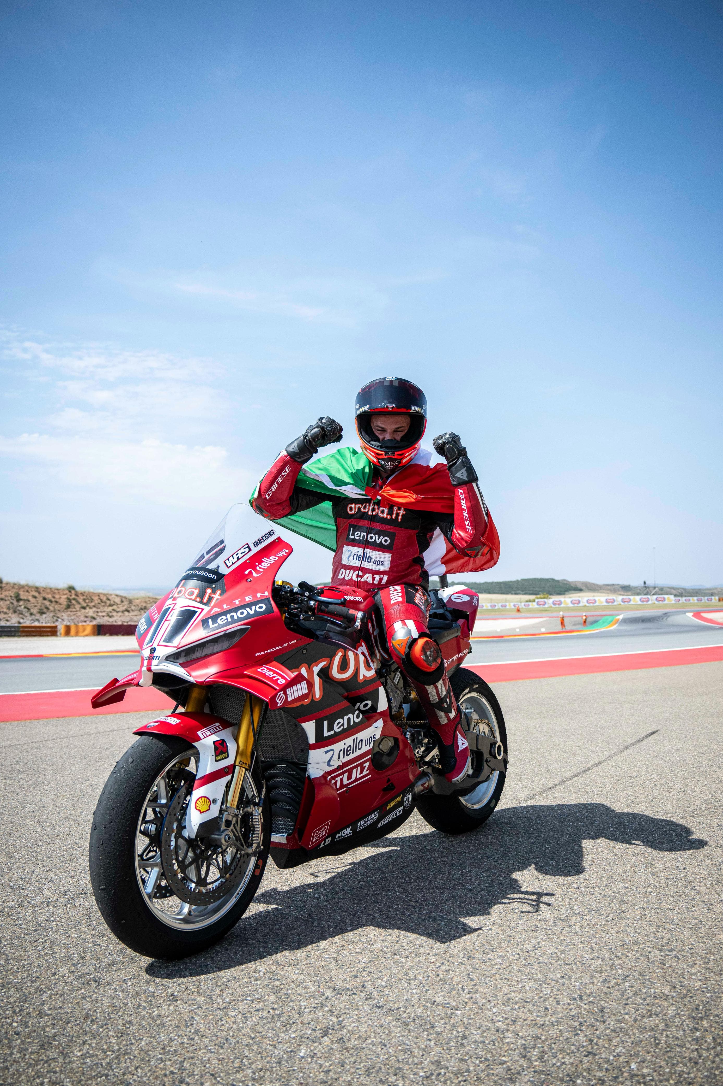 Nicolò Bulega celebrating with the Italian flag on his Ducati Panigale V4R at MotorLand Aragón 2026